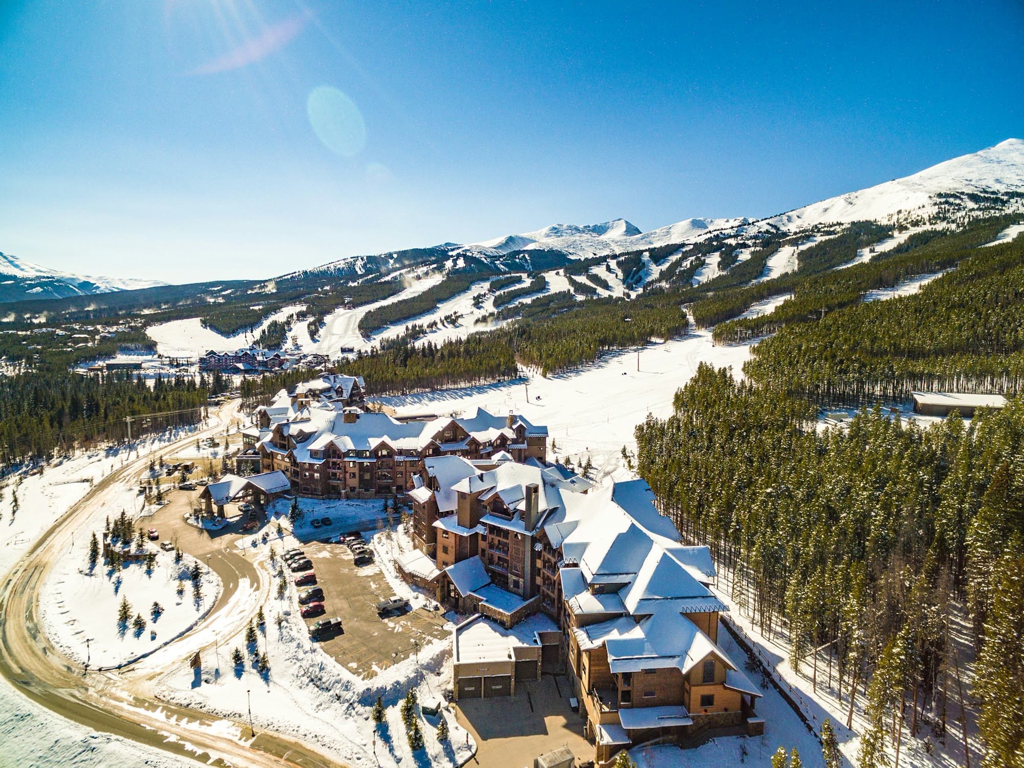 Aerial view of Breckenridge Ski Resort, with the village and ski runs below the peaks