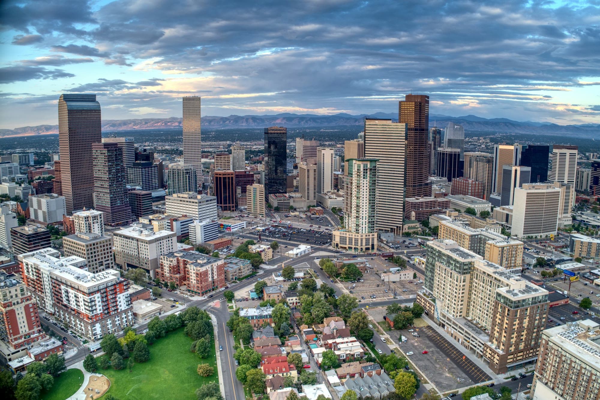 Daybreak over downtown Denver, with the Rocky Mountains to the west of the skyline